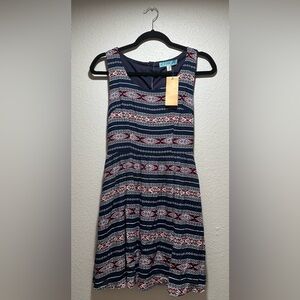 Francesca’s Aztec print dress with back cut-out/tie. Women’s size XS.